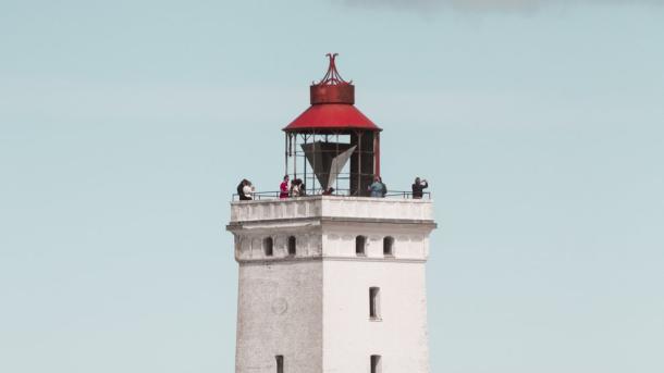 Rubjerg Knude Lighthouse in front of blue sky, North Jutland in Denmark