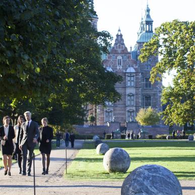 People walking in King's Garden with Rosenborg Castle in the background