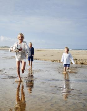 Kids running on Saltum Beach in North Jutland