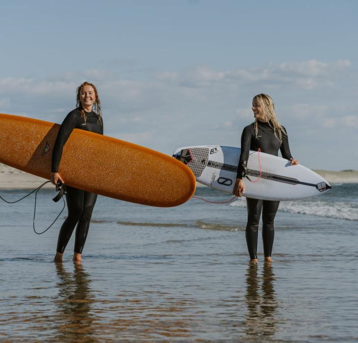 Two female surfers in Hvide Sande on the Danish West coast.