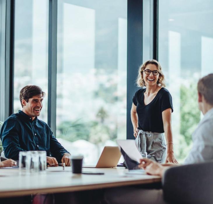 Four people enjoy a relaxed meeting
